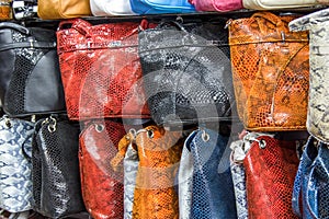 Bags, suitcases, purses and scarfs in shop of leather goods and accessories