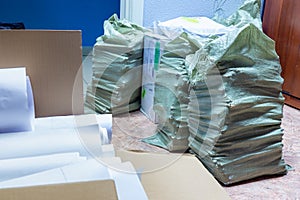 bags with waste papers prepared for loading and sending for recycling