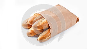 Baguette bread in paper bag on white background