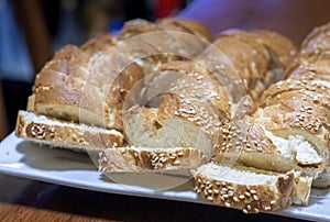 Baguette bread sliced and arranged on a serving plate