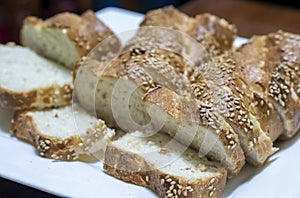 Baguette bread sliced and arranged on a serving plate