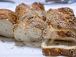 Baguette bread sliced and arranged on a serving plate