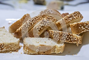 Baguette bread sliced and arranged on a serving plate