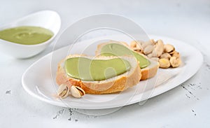 Baguette with pistachio butter photo