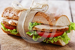 Baguette sandwich with grilled chicken photo