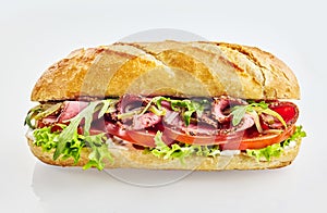 Baguette sandwich with roast beef and vegetables