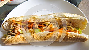 Baguette and sardine sauce  in Cambodia gravy style with Khmer pickles make from white radish and carrots, This food called : Nom