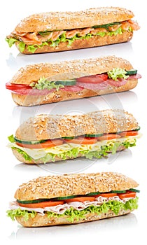 Baguette sub sandwiches with salami ham cheese salmon fish stack photo