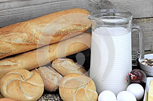 Baguette and various breads and foods on Wall background