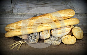 Baguette and various breads on Wall background
