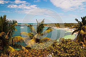 Bahia Honda State Park beach, palm trees and tropical lagoon with docked yacht
