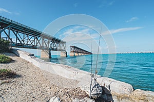 Bahia Honda State Park in the Florida Keys - fishing poles in front of old overseas highway  bridge on sunny day