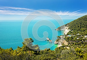 Baia delle Zagare beach, Gargano and Faraglioni Rock formation eroded by waves in Puglia, famous touristic destination