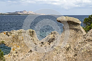 Baia Sardinia Coastal View with Naturally Sculpted Rocks and Distant Island of Isola Caprera : Baia Sardinia, Gallura, Sardinia, I photo