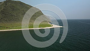 Baikal beach, Siberian mountains, dawn fog, boundless mountains