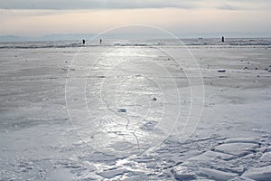 Baikal ice against cloudy skies.