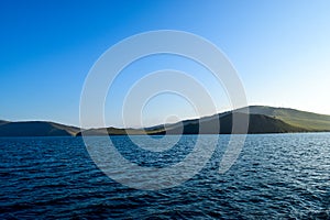 Great Lake Baikal overlooking the mountains, Small Sea Olkhon Island photo