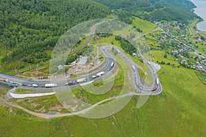 The Baikal serpentine road - aerial view of natural mountain valley with serpantine road, Trans-Siberian Highway, Russia