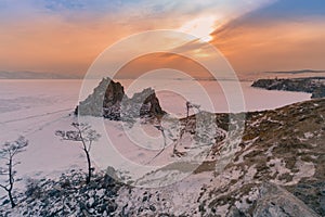 Baikal winter water lake with sunset sky background