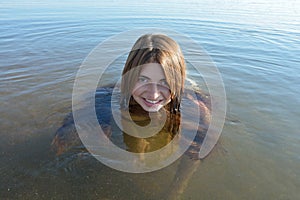 Baikal young, beautiful girl smiling floats
