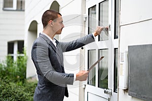 Bailiff Debt Collector Man Knocking Door photo