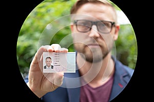 Bailiff standing at entrance showing id