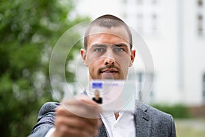 Bailiff Standing At Entrance Showing Id