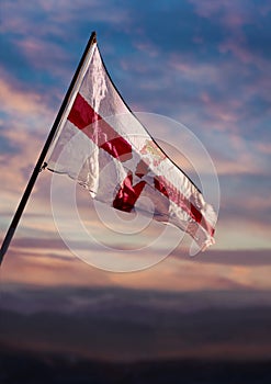 Bailiwick of Jersey flag, Jersey flag waving on sky at dusk