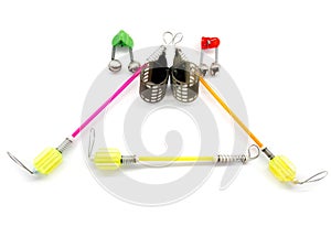 Bait feeder, bite alarm and fish bells isolated on white background. Composition of signaling devices for fishing.