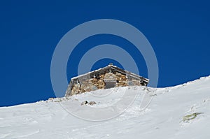 Alpine hut in the snow photo