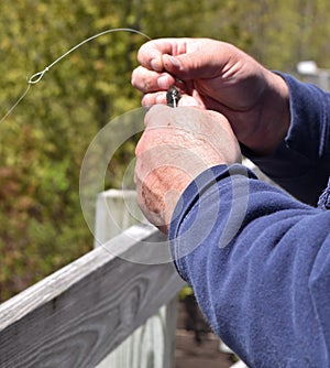 Baiting a fishing hook with a minnow