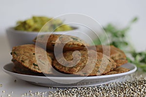 Bajra methi puri. Deep fried Indian flatbread made of pearl millet flour and fenugreek leaves. Served with spiced mashed potato