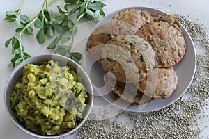 Bajra methi puri. Deep fried Indian flatbread made of pearl millet flour and fenugreek leaves. Served with spiced mashed potato