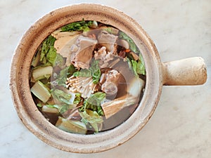 Bak kut teh serving in clay pot, a pork rib dish cooked in broth popularly served in Malaysia and Singapore