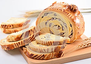 Bake bread with wood grain on a block wood on white background