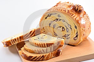 Bake bread with wood grain on a block wood on white background