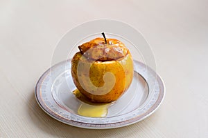 Baked Apple drizzled with honey. The concept of a healthy diet without sugar and flour.