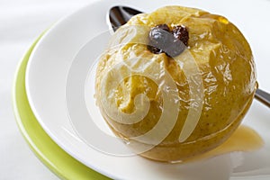 Baked Apple with Raisins and Honey Syrup