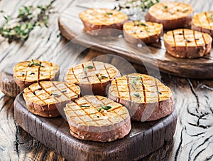 Baked batata on the old wooden table photo