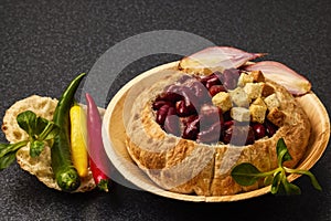 Baked bean dish in bread crust. Mexican food