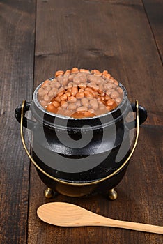 Baked beans in pot with spoon