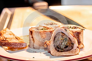 Baked beef bones with bone marrow are on a plate