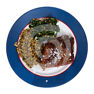 Baked beef loin with green lentils and spinach