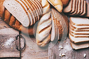 Baked bread on wooden table background