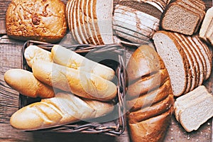 Baked bread on wooden table background