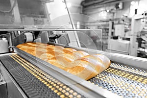 Baked breads on automatic production line bakery from hot oven