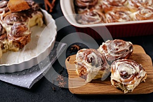 Baked Buns on Wooden Cut Board and Baking Dish