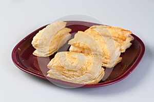 Baked butter cheese puffs in a melamine plate