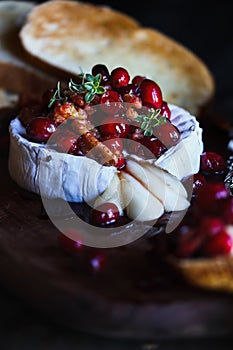 Baked Camembert Brie cheese with a cranberry honey and nut relish