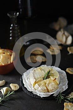 Baked Camembert cheese with rosemary and garlic